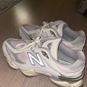 9060 New Balance sneakers. Light pink, white, and grey.